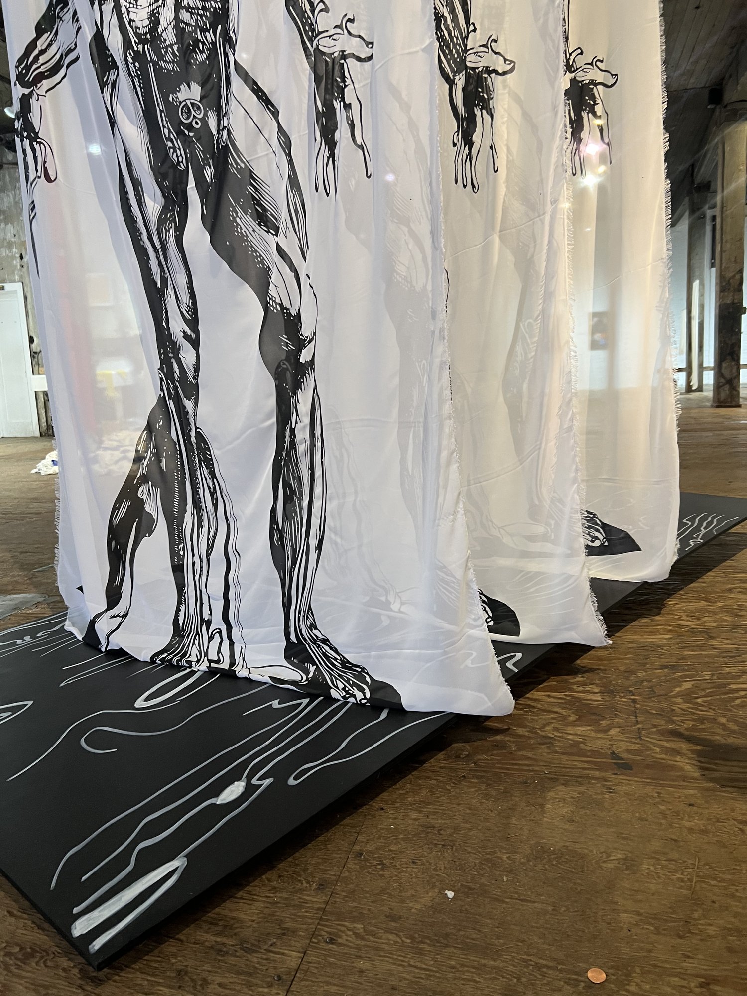assemble, installation view at Liminal Forms, The Invisible Dog Art Center, Brooklyn, 2023 — detail of lower-body silk panel with birch base