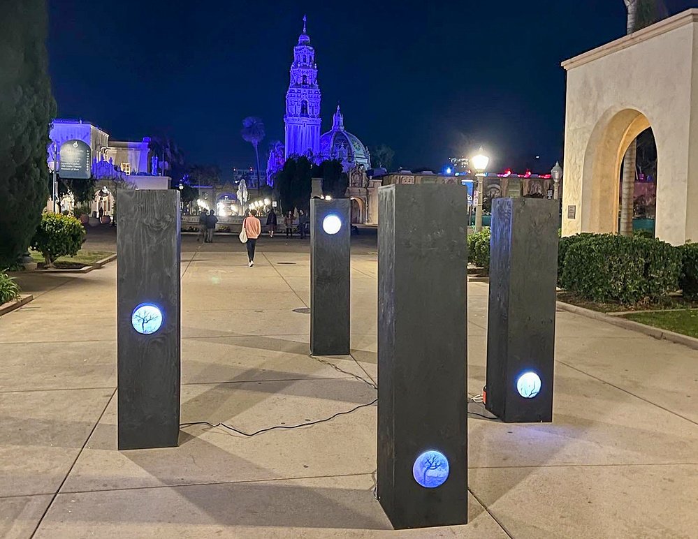 lost trees, installation view, Balboa Park, San Diego, 2022 — four columns at night