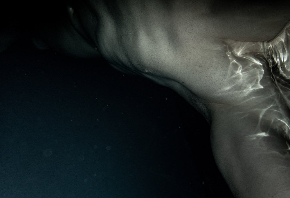 night swim #7, nude figure underwater with caustic light reflections, 2020