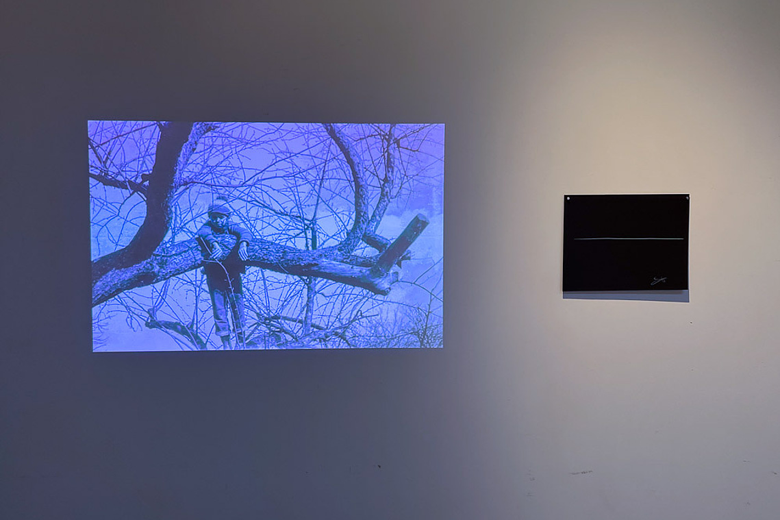 the giveaway, installation view at Space 4 Art, San Diego, 2023 — book on pedestal, projector stations on sawhorses, video projections on wall